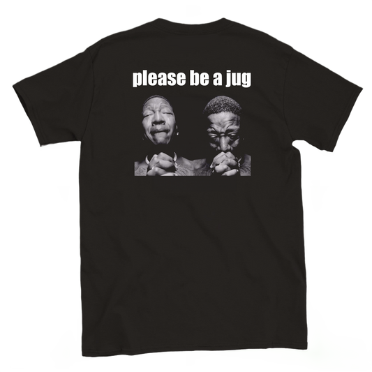 Back view of a black climbing T-shirt featuring Please Be a Jug text above a black-and-white praying meme.